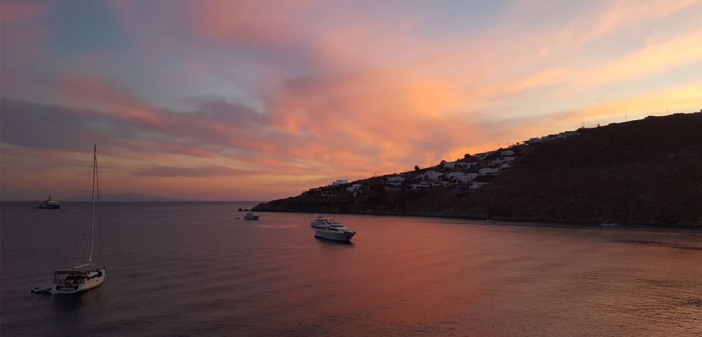 Wonderful colors spreading across the sky and sea as the sun sets, captured from Phos Restaurant in Mykonos